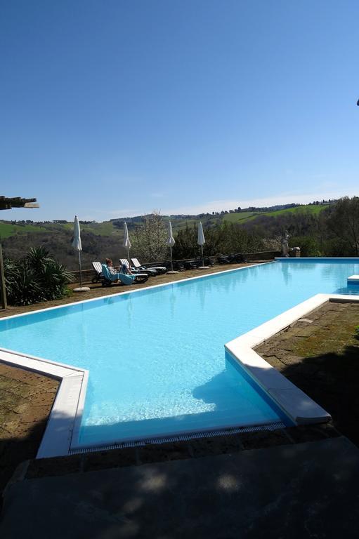 Le Valli Aparthotel Pomarance Bagian luar foto
